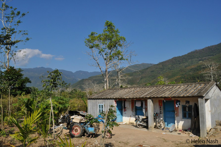 Villagers live beside nature reserve perimeters in Hainan